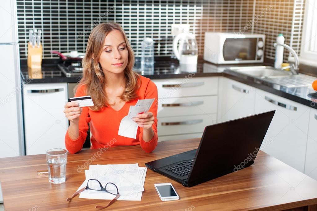 Woman holding bank card