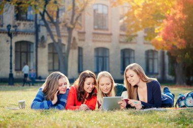 Four happy young woman