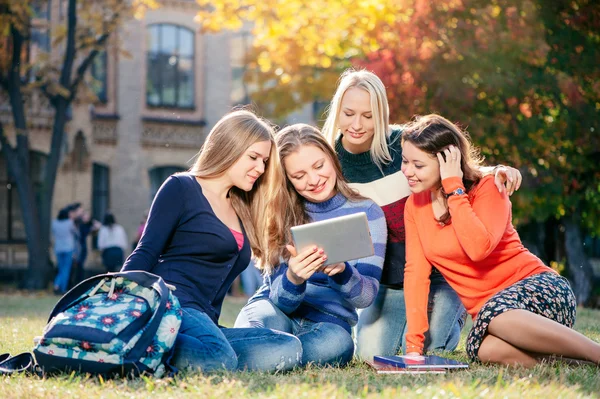 Four happy female students — 스톡 사진