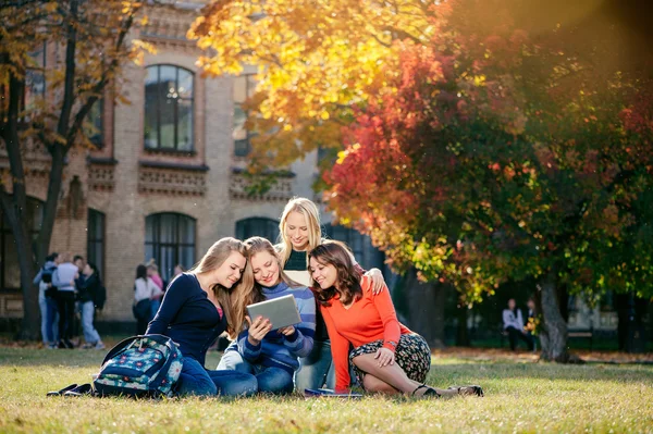 Four happy female students — Stock fotografie