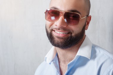 man with a beard in sunglasses clipart