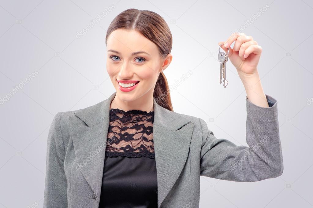 woman showing keys