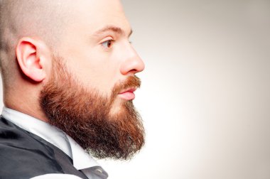 Profile of young bearded man clipart
