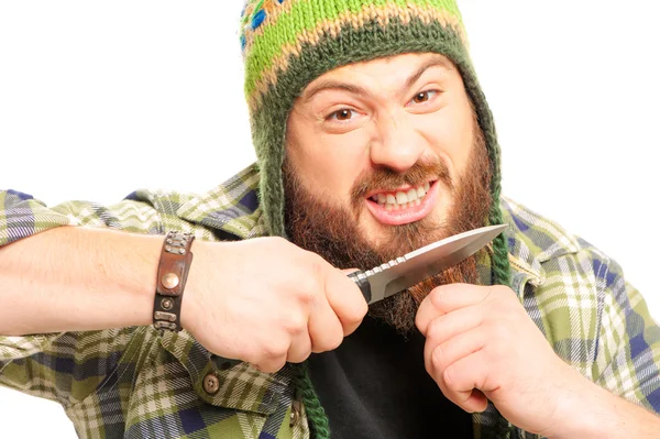 Hombre cortando su barba con un cuchillo — Foto de Stock
