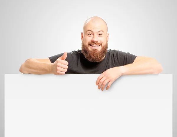 Бородатий чоловік показує великий палець вгору — стокове фото