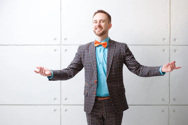 Cheerful young man in plaid suit — Stok fotoğraf