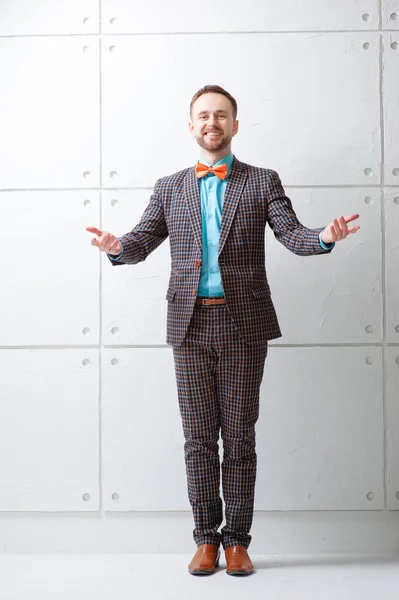 Cheerful young man in plaid suit — Stok fotoğraf