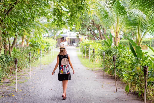 Young woman with backpack outdoors — Stock Photo, Image