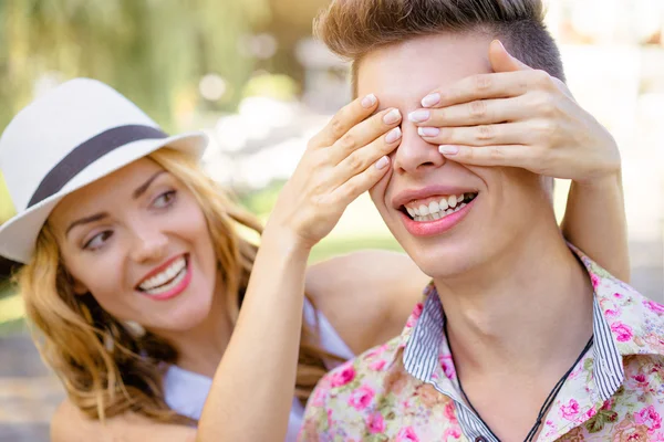 Woman closed eyes of her boyfriend — Stock Photo, Image