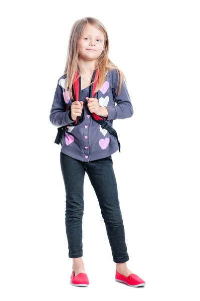 Little girl standing with backpack Stock Picture