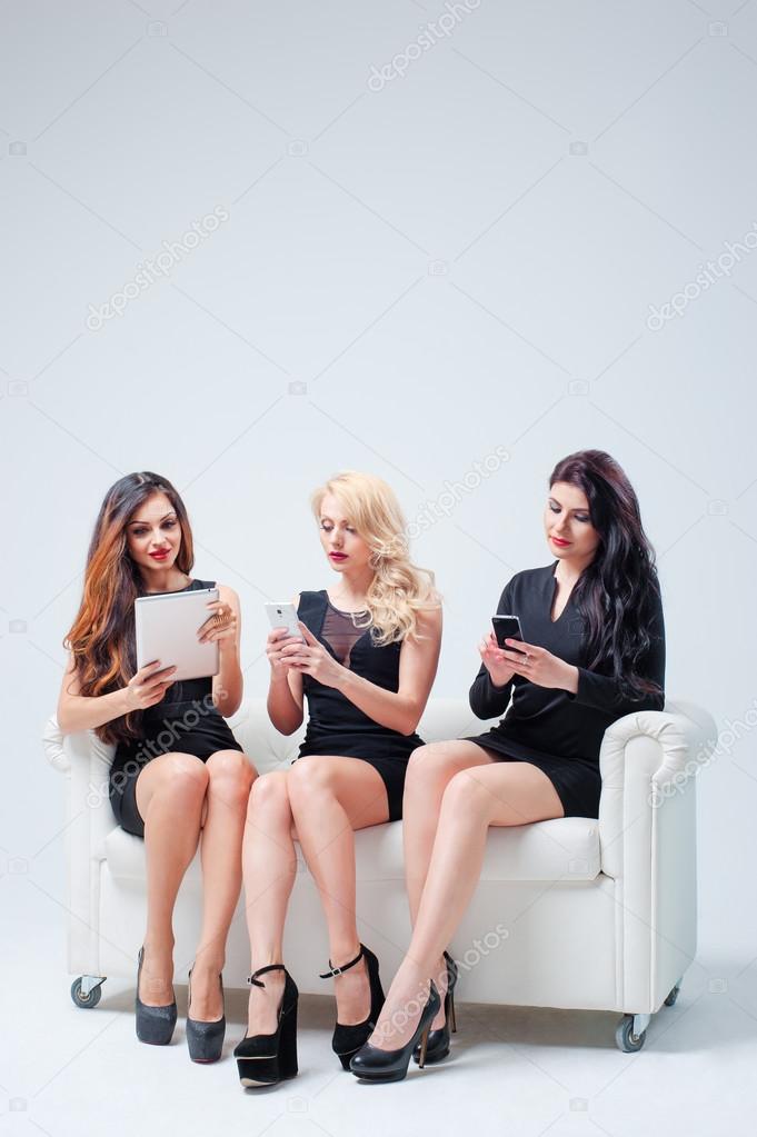 Women using digital gadgets