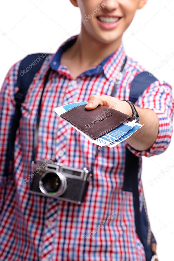 Man holding passport with boarding pass