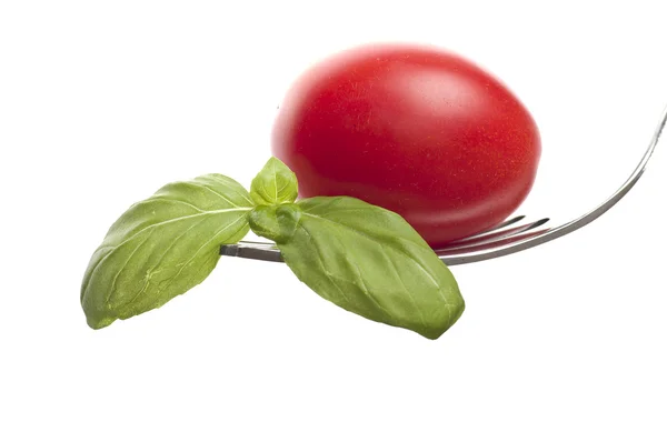 Eisengabel mit frischen Tomaten — Stockfoto