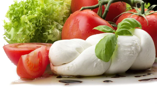 Mozzarella tomatoes and fresh salad — Stock Photo, Image