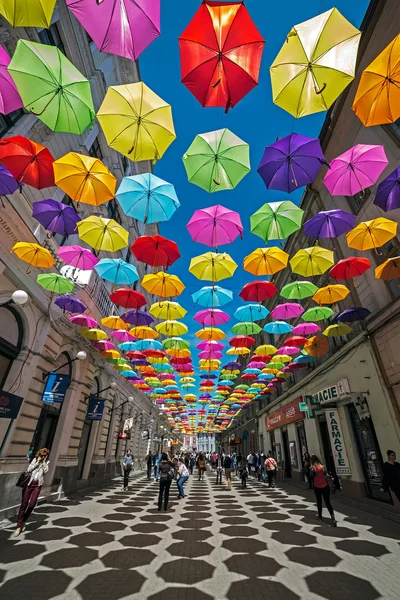 Street with colored umbrellas and shadows in Timisoara — Stock Photo, Image