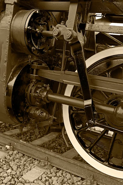 Sepia detail and close up of huge wheels at one old steam locomotive 14 — Stock Photo, Image