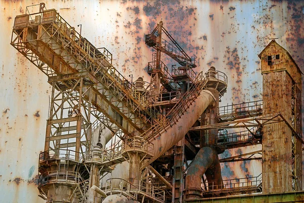 Rusty background with old steel furnace — Stock Photo, Image