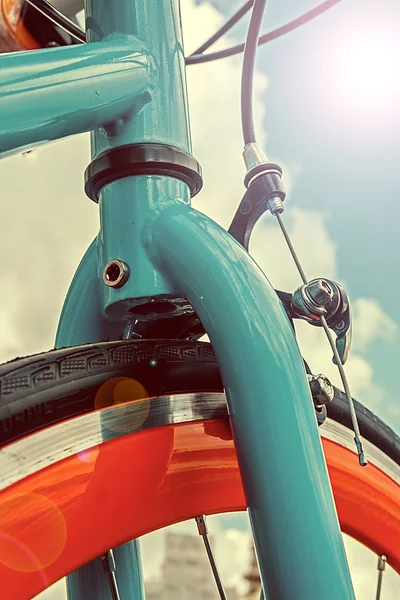 Vintage look at one bicycle in lens flare reflection — Stock Photo, Image
