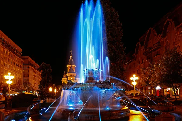 Cyan illuminated fountain on the Plaza Opera in Timisoara 1 — Stock Photo, Image