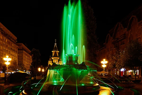 Green illuminated fountain on the Plaza Opera in Timisoara — Stock Photo, Image