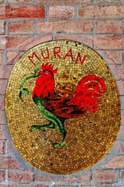 Colorful mosaic on the street of Murano, Italy