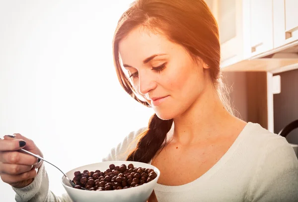 Woman with bowl of coco cereal, homemade breakfast — Stock Photo, Image