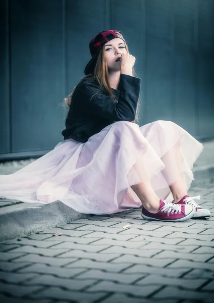 Trendy beautiful long haired girl posing, hip hop fashion — Stock Photo, Image