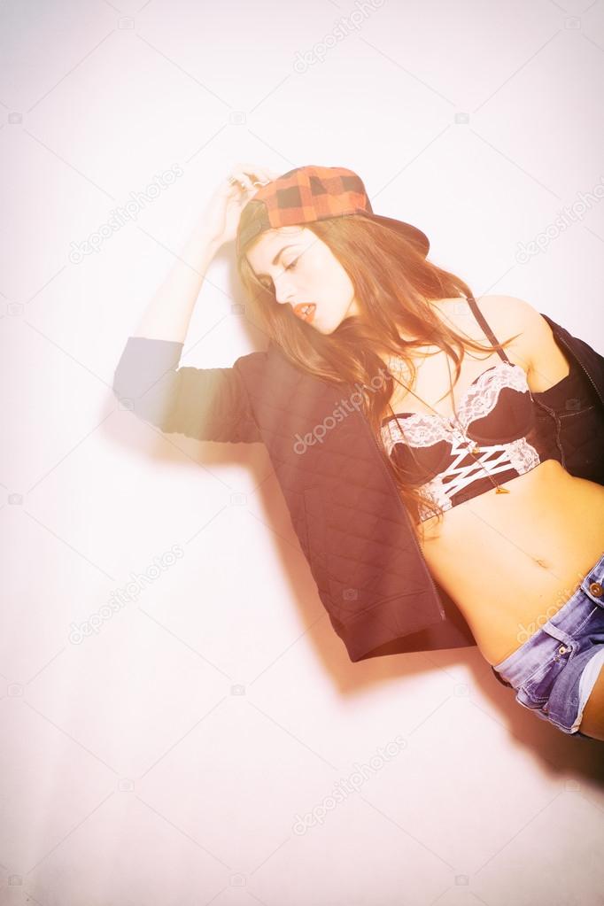 Closeup fashion studio portrait of hipster girl