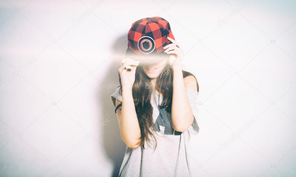 Closeup fashion studio portrait of hipster girl