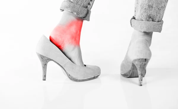 Woman's legs, ankle pain in high heels — Stock Photo, Image