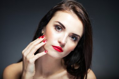 Natural woman face with red nails and lips clipart