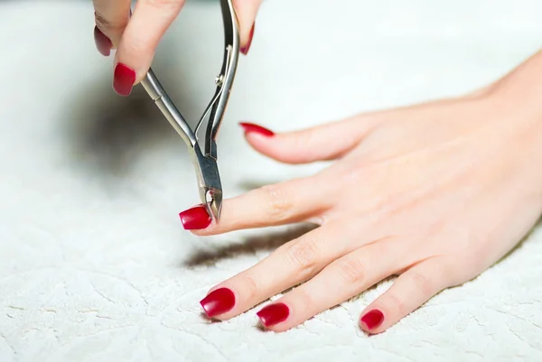Woman hand manicure trimming cuticles — Stock Photo, Image