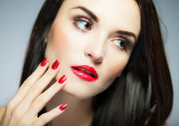 Natural woman face with red nails and lips — Stock Photo, Image