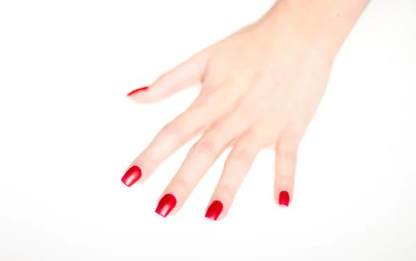 Main de femme avec ongles rouges, concept de manucure — Photo