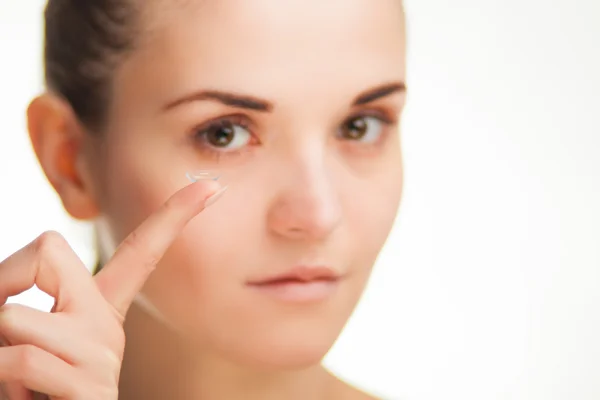 Woman with contact lens on finger healthcare concept — Stock Photo, Image