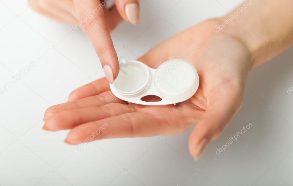 Contact lens on finger with case