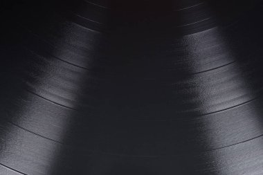 Siyah vinil plak oluğu arkaplanı veya doku yakın çekim makro çekimi.