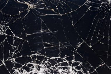 Çatallı kırık cam dokusu. Siyah çatlamış akıllı telefon ekranı