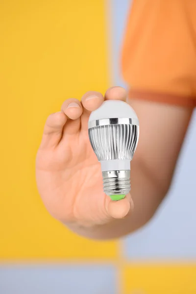Worker with bulb — Stock Photo, Image