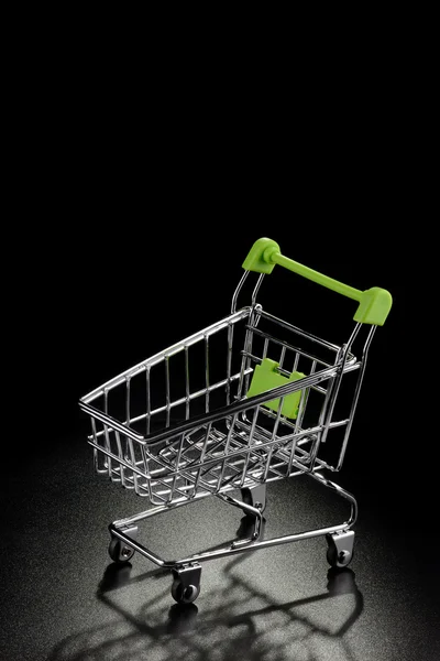 Shopping cart on a black background — Stock Photo, Image