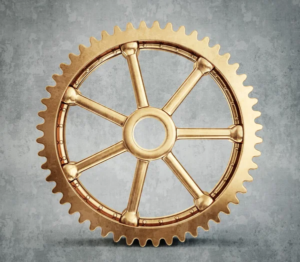 Gold gear isolated on grey — Stock Photo, Image