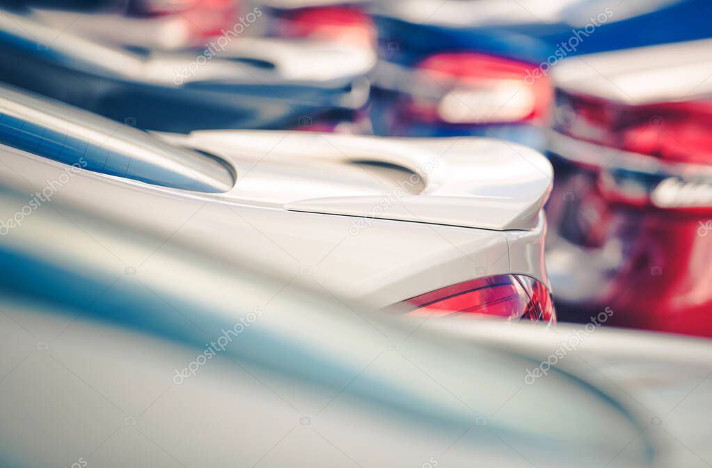 Automotive Market Theme. Car Dealership Brand New Vehicles For Sale on Dealer Parking Lot. Colorful Cars Close Up. Transportation Industry.