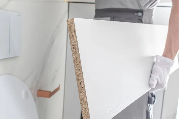 Worker Assembling Elegant White Painted Bathroom Furnitures Elements — Stock Photo, Image