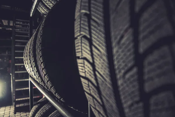 Winter Car Tires Shelf Storage Inside Large Residential Garage. Automotive Theme.