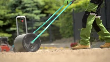 Compacting Soil Using Lawn Roller