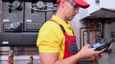 June 1, 2021. Krakow, Lesser Poland. Professional Caucasian Worker in His 40s Looking For Gas Leaks Using Professional Detector