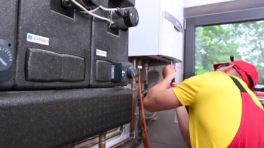 June 1, 2021. Krakow, Lesser Poland. Professional HVAC Technician Checking on Gas Heater