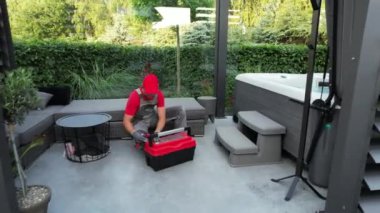 SPA Technician in His 40s Finishing Modern Hot Tub Installation