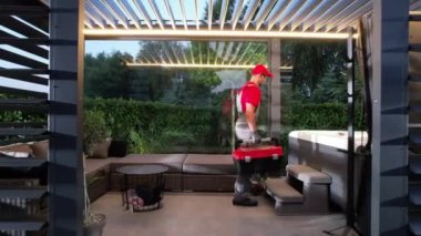 Professional SPA Technician in His 40s Finishing Modern Hot Tub Installation