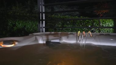 Colors Changing Illuminated Hot Tub Jacuzzi Fountain and Skimmer Close Up
